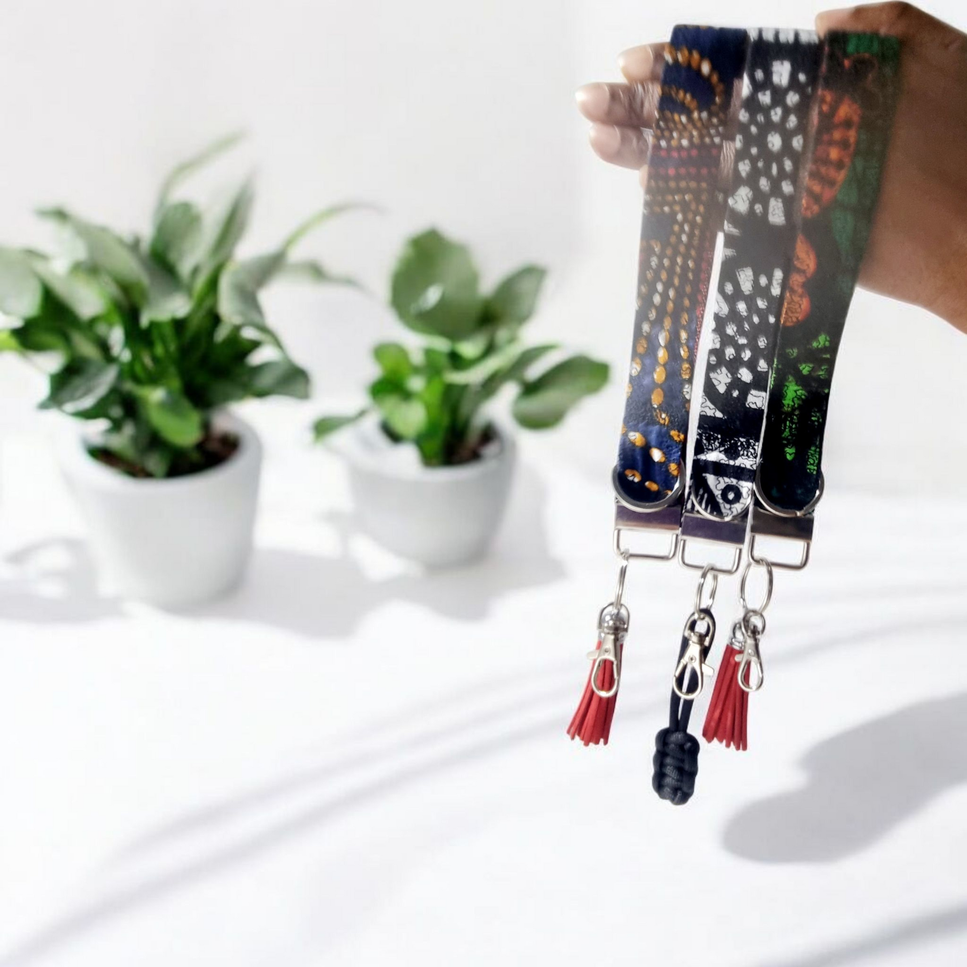 Hand holding African Cotton key fobs